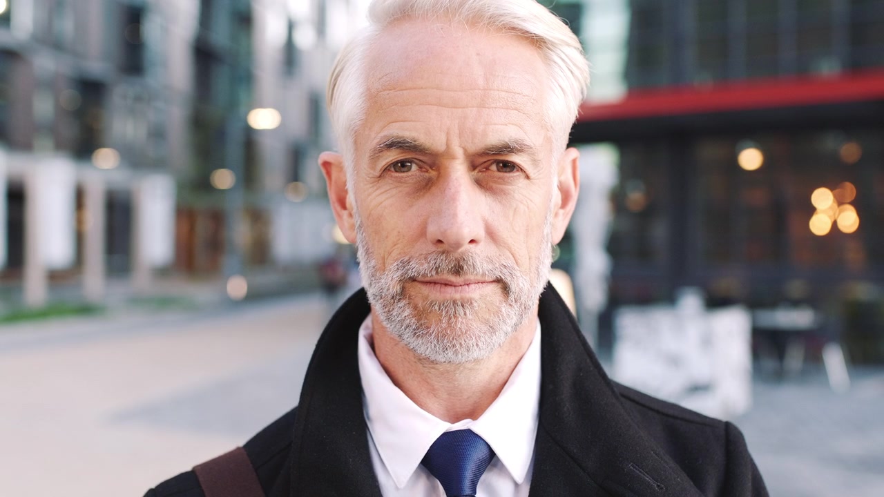 Portrait of a Mature Businessman Standing Outdoors in the City