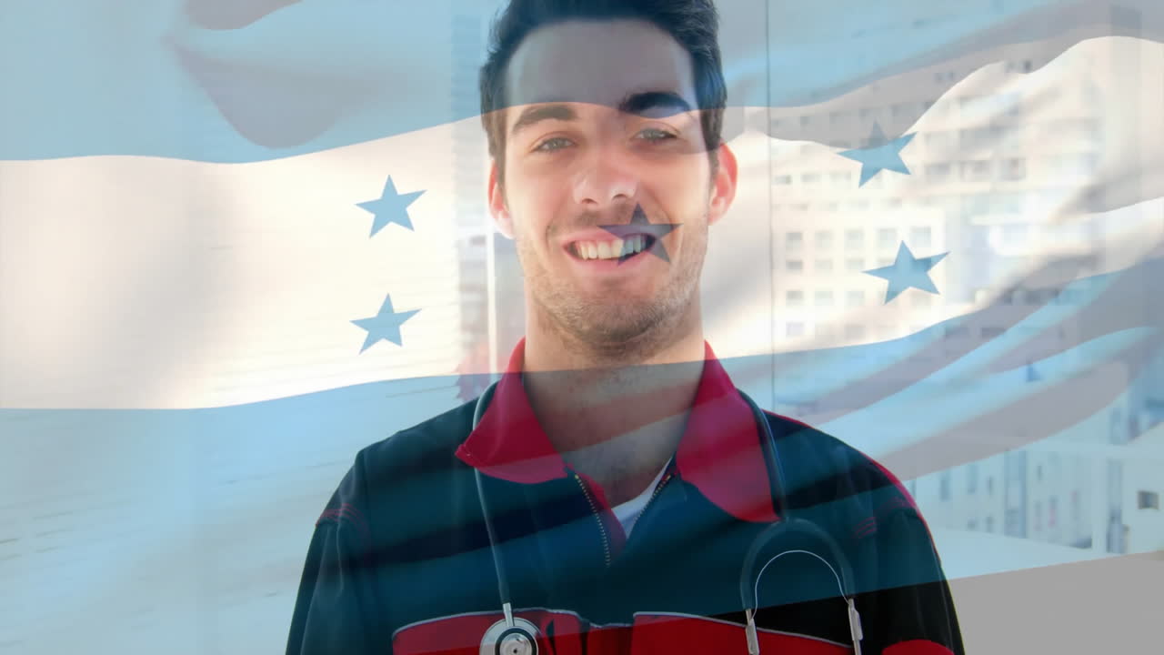 Animation of flag of honduras over caucasian male doctor in hospital