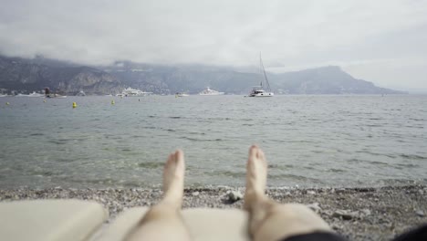 Relaxing-At-Beach-Club-In-South-Of-France-With-Mountain-Views-And-Boats