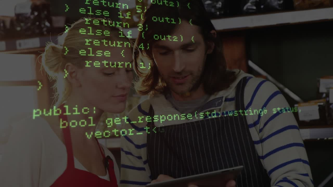Code overlay fading in, colleagues leaning over tablet at counter, exploring technology functions