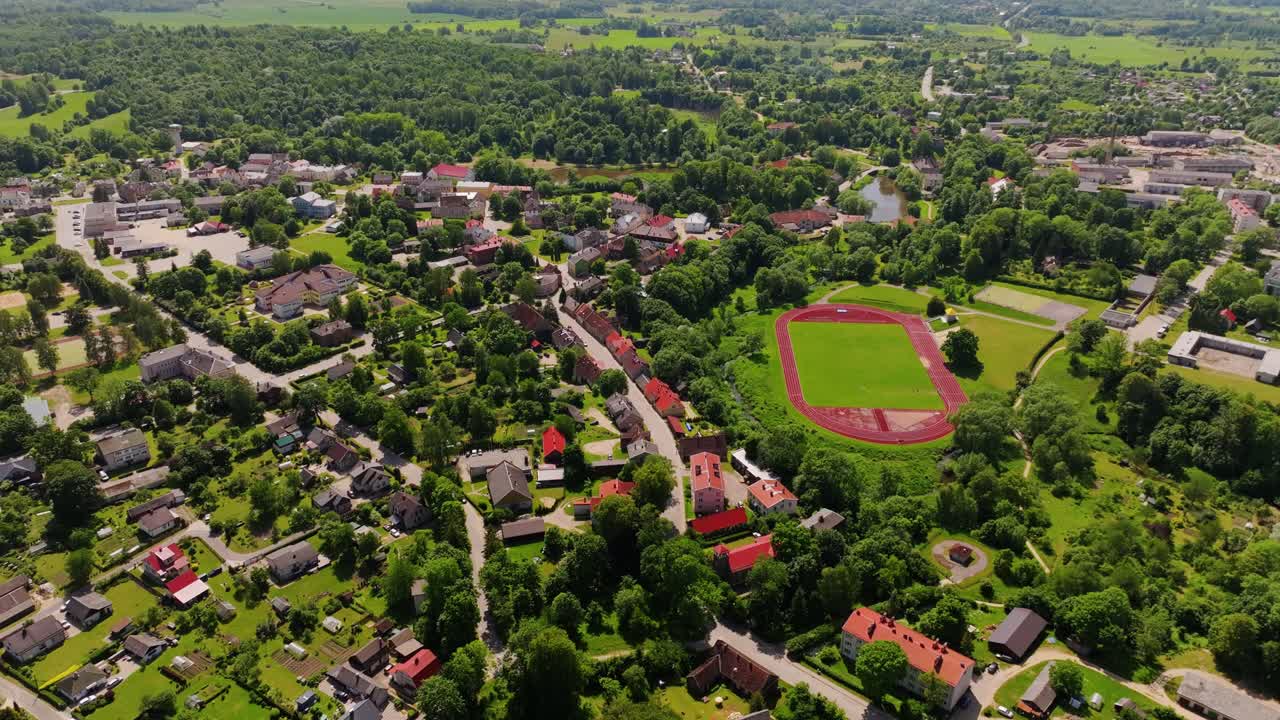 Scenic town of Aizpute in Latvia shown from above with urban and rural mix