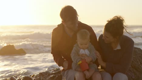 family relaxing in the beach 4k