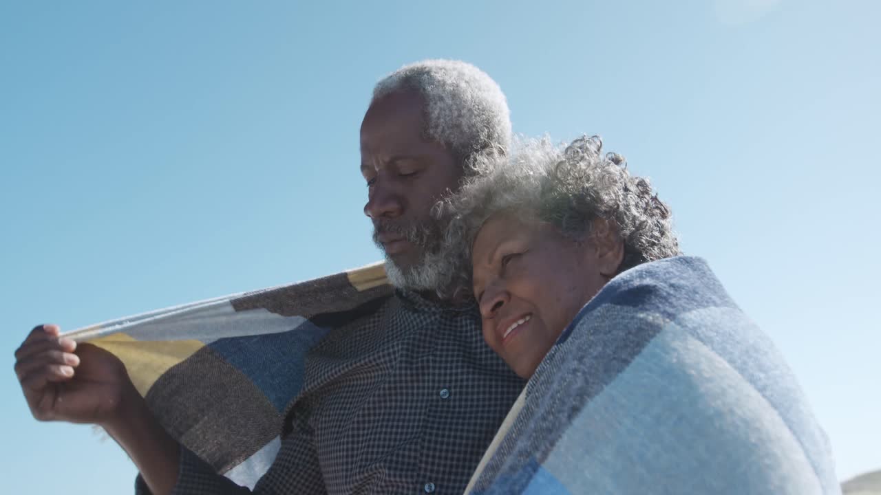 Senior couple enjoying free time at the beach