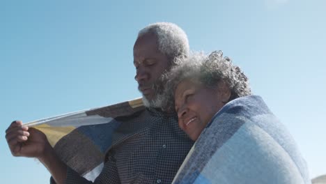 Senior-couple-enjoying-free-time-at-the-beach