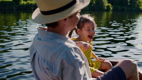 father and daughter enjoying a day on a boat