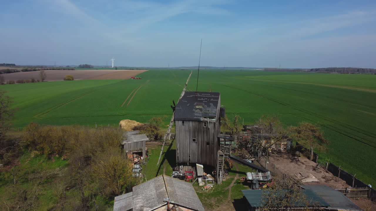 Old Windmill and Farmland Landscape