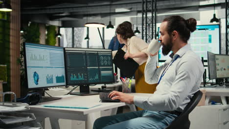 vertical video professional consultant reviewing financial data forecast on pc screen