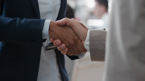 close up business people shaking hands  corporate partnership deal welcoming opportunity for cooperation in office