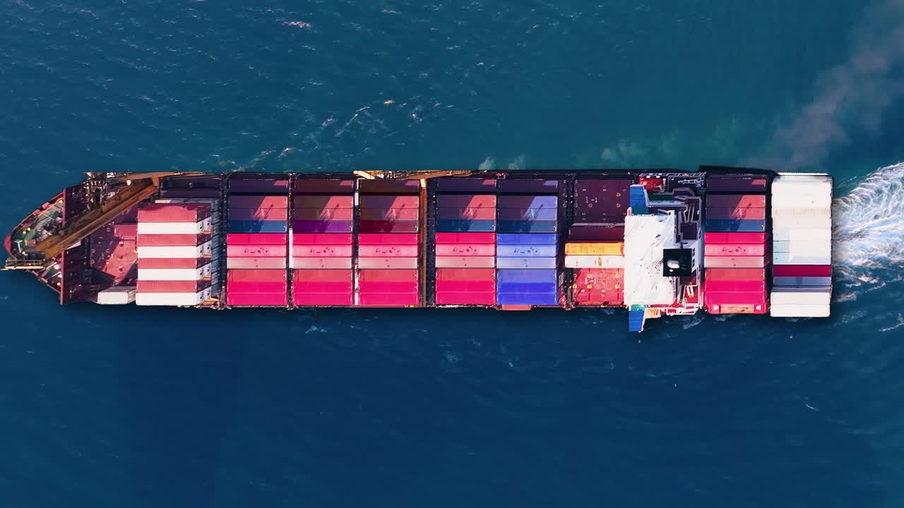 Container ship navigates busy trade routes while carrying cargo in pallets during global shipping disruptions