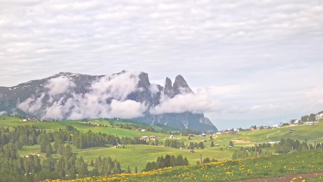 Dolomites Alpine mountain meadow with Sciliar massif CLOUD TIME LAPSE