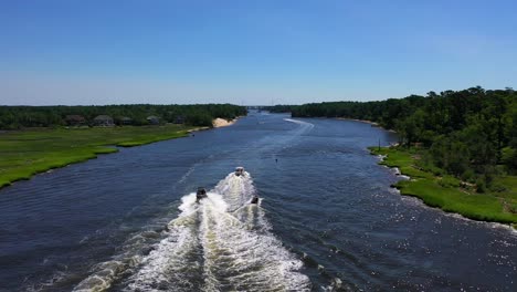 boating in a river adjacent to a park