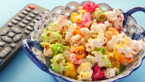 colorful popcorn and tv remote