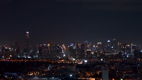 skyscrapers and high-rise buildings in bangkok city at night, thailand. downtown financial district. 4k cityscape vdo