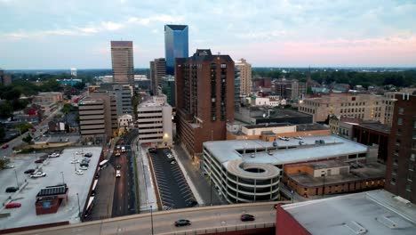 aerial push over traffic into lexington kentucky skyline