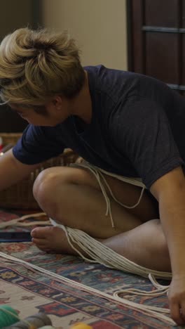 person doing macrame craft