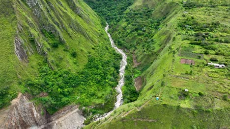 Aerial-drone-view-of-Urubamba-river-crossing-the-jungle,-close-to-Machu-Picchu-Pueblo,-sacred-valley,-Cusco-region,-Andes,-Peru,-South-America