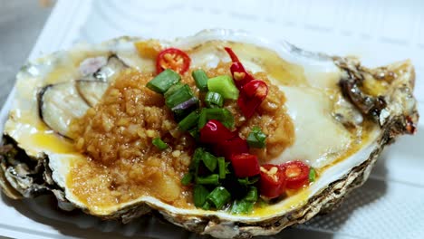 delicious grilled oyster with vibrant toppings