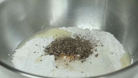 Close-up-of-Egg-and-Flour-with-Salt-and-Pepper