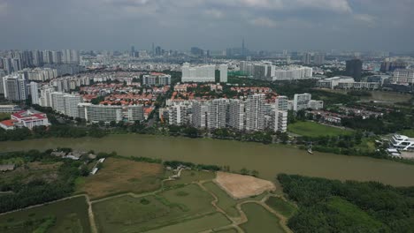 ultra modern city development with residential and commercial high rise buildings, villas, green space and river