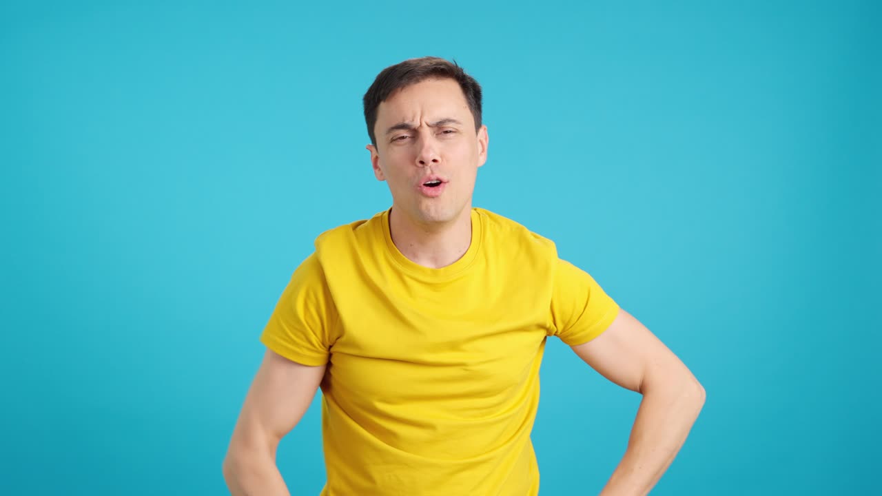 Man expressing emotions against blue background