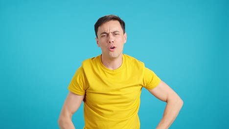 man expressing emotions against blue background