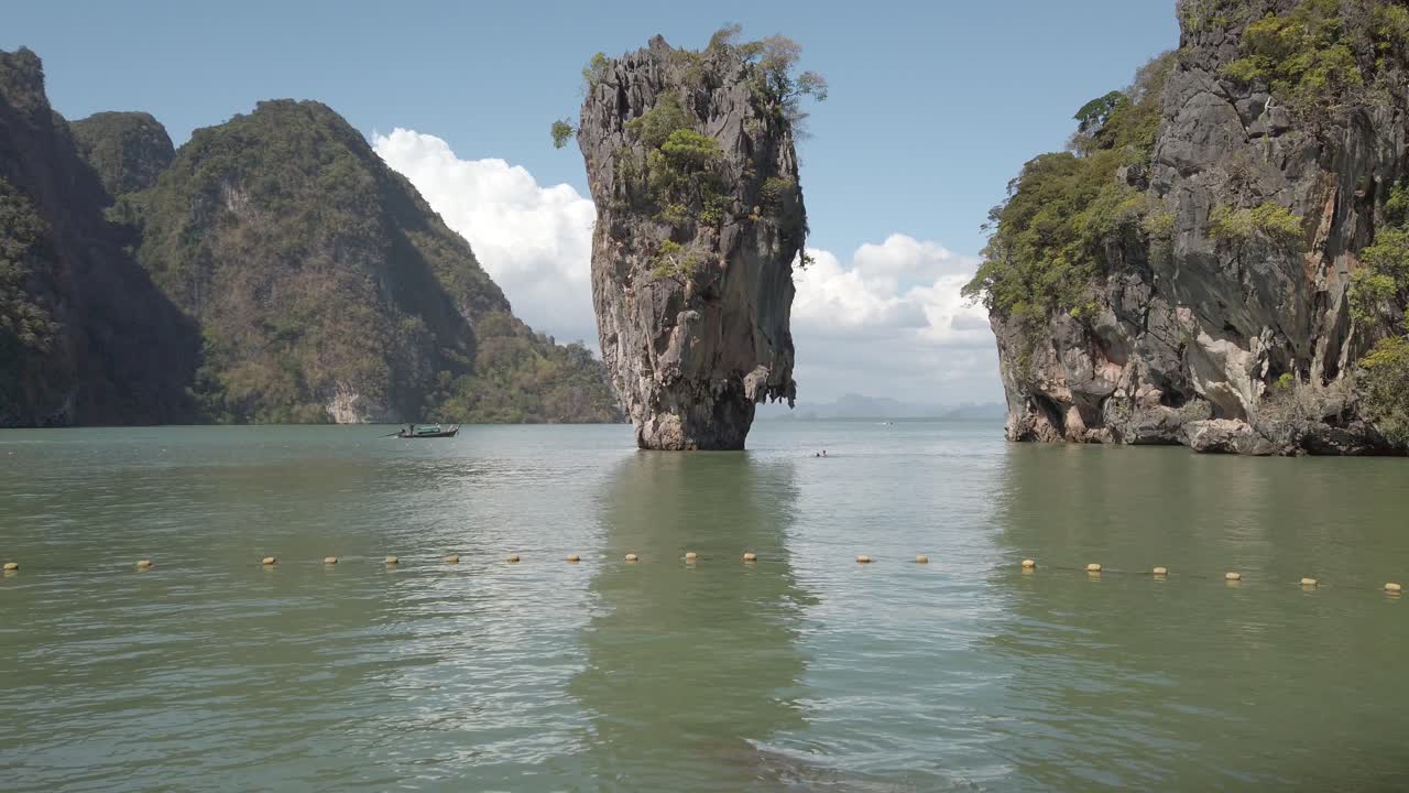 Wide view of the iconic Ko Ta Pu rock and Tapu, James Bond Island in Phuket Thailand.