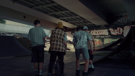 Teenage-friends-meeting-together-in-urban-skate-park-for-leisure.-Youth-culture
