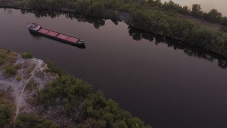long comercial ship navigating over the waters of dnipro river in ukraine
