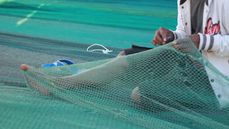 fishermen-are-repairing-nets-in-preparation-for-fishing-in-the-sea