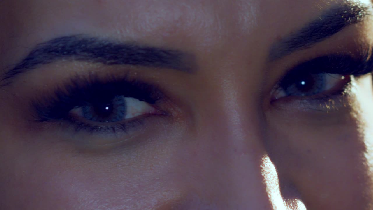 Close up of beautiful Hispanic girl's eyes, slow motion