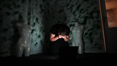 Teenage-Boy-Victim-of-Online-Harassment,-Reading-Hate-Messages-on-Laptop-and-Covers-His-Face