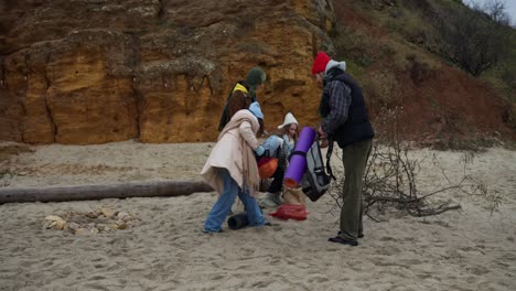 friends cleaning up beach