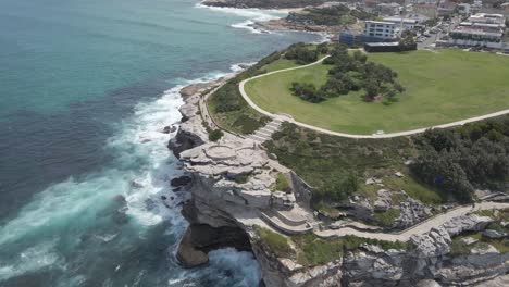 People-Walk-At-Coastal-Walk-Passing-By-Marks-Park-At-Mackenzies-Point---Tamarama,-NSW,-Australia