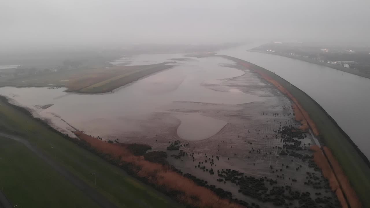 Aerial shot of landscape flooded by river water from the river Noord.