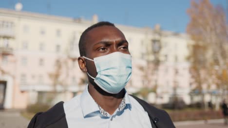 man wearing face mask outdoors