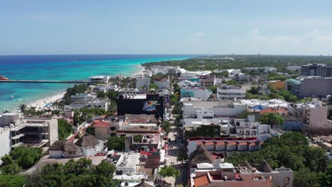 aerial wide shot flying over la quinta avenida in playa del carmen, mexico