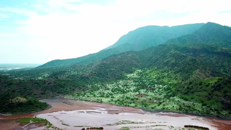 idyllic view of forest mountains surrounded in lake natron, tanzania, east africa