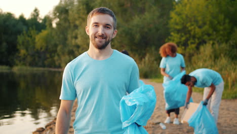 community volunteers clean up a riverbank