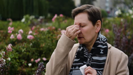 woman struggling with tears in the middle of the street