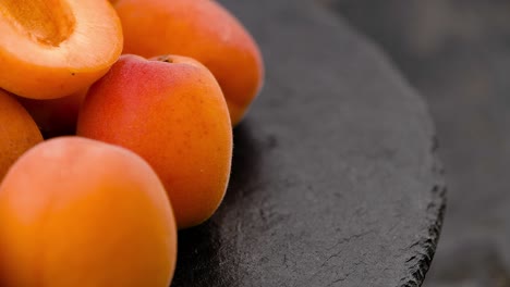 portion of apricots on a rotating plate (seamless loopable)