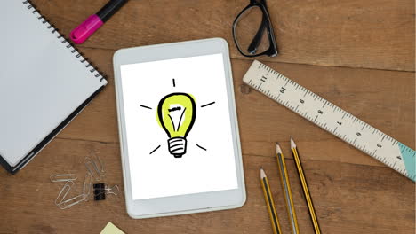 animation of a digital tablet showing drawing of a light bulb on the screen