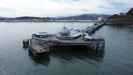 elegant stretching victorian welsh llandudno pier aerial over flying view on quiet morning