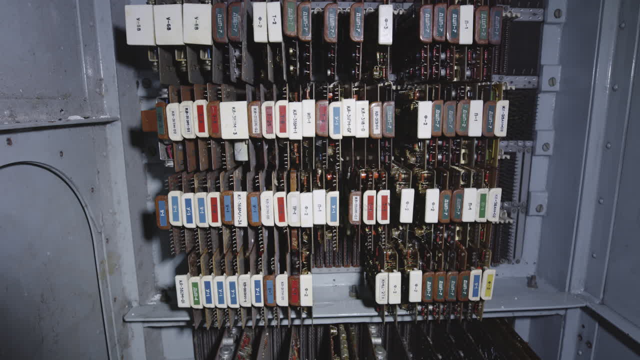 Old Control Panel With Labeled Circuit Boards And Wiring Inside The Chernobyl Nuclear Power Plant. - closeup shot
