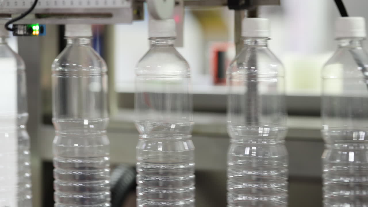 Plastic Water Bottles Being Filled on an Automated Production Line