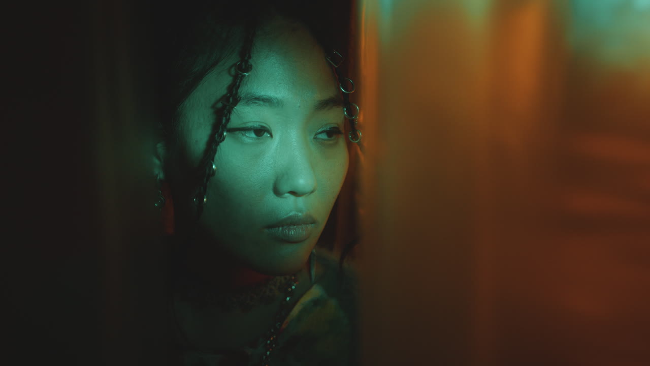 Pretty Asian Woman Posing in Studio with Neon Light and No Signal TV