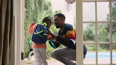 Dad,-child-and-backpack-for-first-school-day