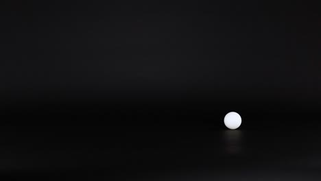 a ping pong ball rolls across a surface