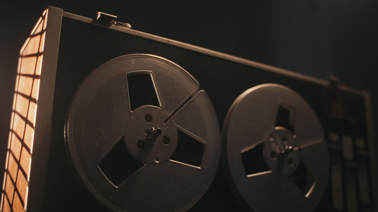 A vintage tape recorder in a pulsing light