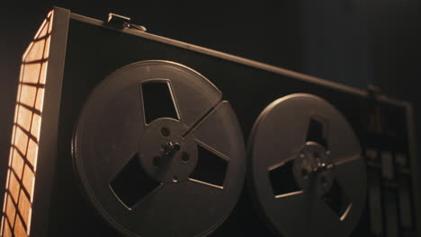 a vintage tape recorder in a pulsing light