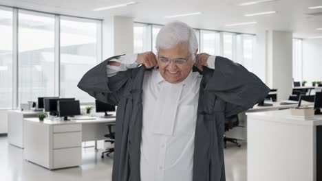 Happy-Indian-senior-lawyer-getting-ready-for-work